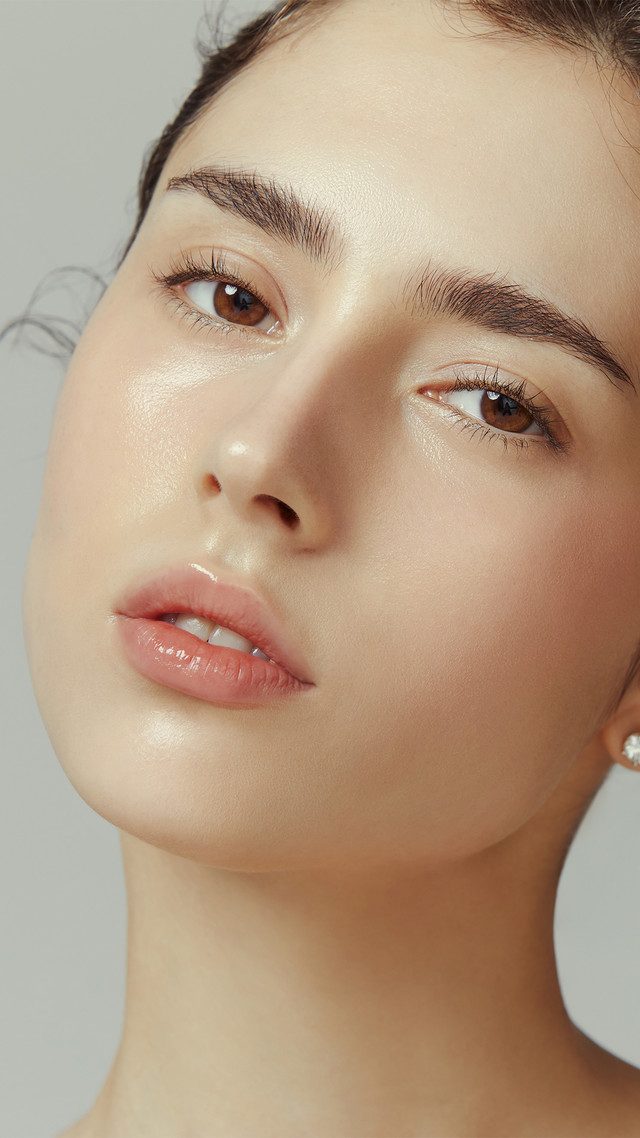 Close-up photo of a woman's face with clear skin